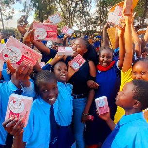 Girls at Kabiria Primary School receiving reusable menstrual pads